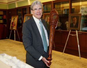 President Frenk holding the Second Ceremonial Mace of the UM.